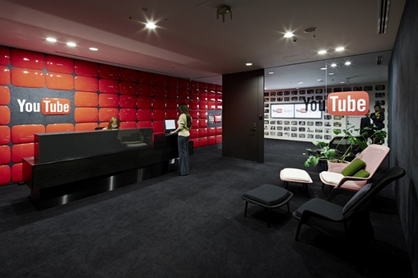 Although owned by Google, the YouTube Tokyo office has its own unique style. Rather than pulling in the bright whites and primary colors of the Google logo, this office uses plenty of black, white, and iconic YouTube red. These choices wind through from the reception area to the studios to the meeting nooks.